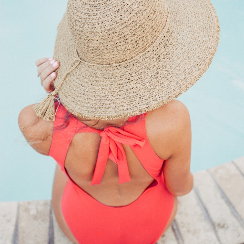 Poppy colored, ruffled neck open back swimsuit